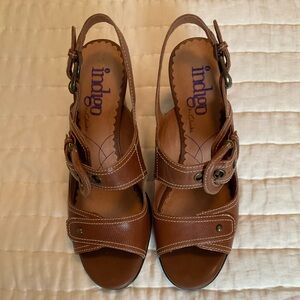 Womens heeled shoes with buckled straps.